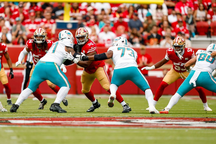 James Thompson Jr. in the 49ers' red home uniform against Miami at Levi's Stadium.
