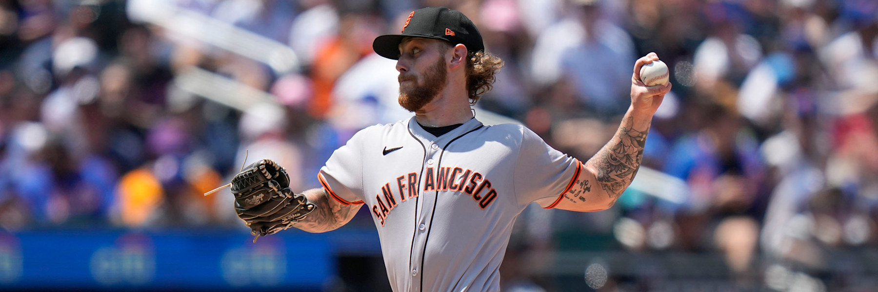 Carson Whisenhunt in the Giants' grey road uniform, SAN FRANCISCO across the chest, delivering a pitch left-handed