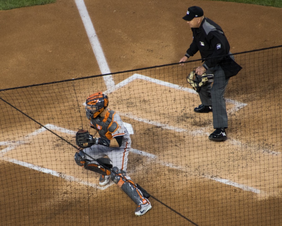Buster Posey in a San Francisco Giants uniform behind the plate during a 2019 game